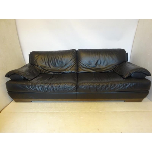 285 - An Italian black leather couch by Natuzzi.  L. 220cm D. 93cm approx.