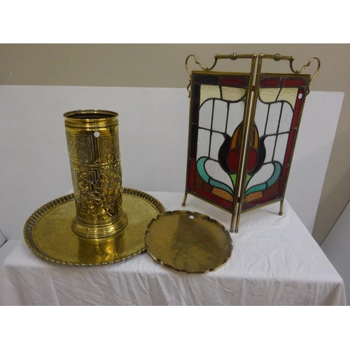 297 - Victorian brass framed and leaded glass firescreen, brass stick stand and two trays.