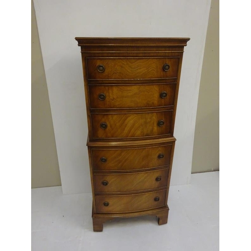 311 - Good quality reproduction tall chest fitted with six drawers. H. 130cm, W. 54cm, D. 43cm approx.