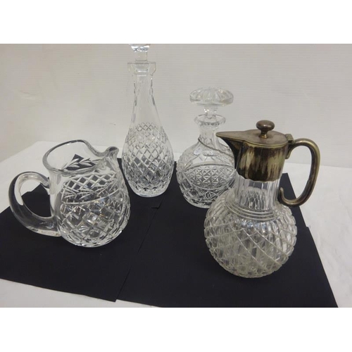 315 - A lot of Waterford and other glass ware - two decanters, one water jug and a plated top claret jug. ... 