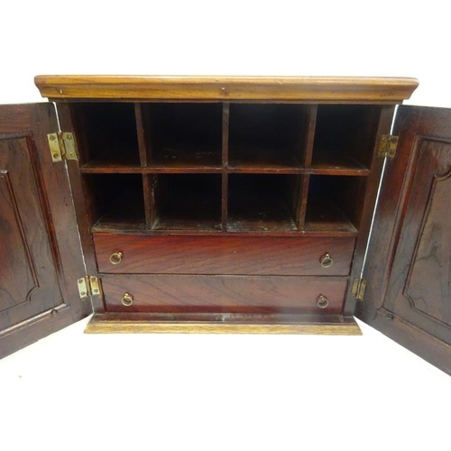 316 - Antique mahogany two door table top cabinet, the interior with shelves and drawers. 40cm x 30cm . H.... 