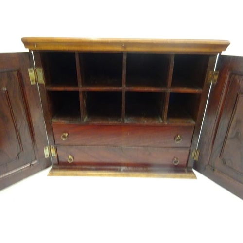 316 - Antique mahogany two door table top cabinet, the interior with shelves and drawers. 40cm x 30cm . H.... 