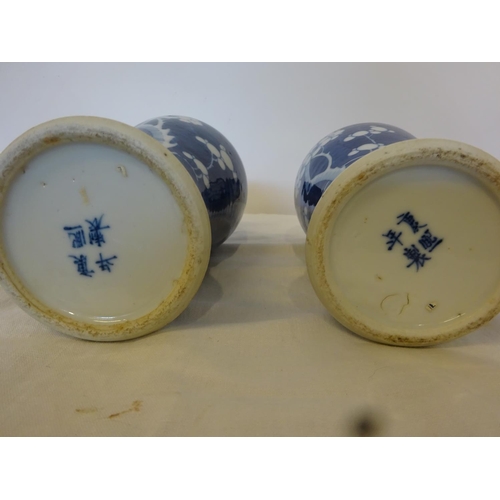 332 - A collection of Chinese blue and white china ware - pair of vases, single vase and two ginger jars a... 