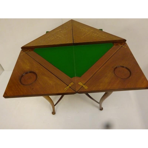 338 - Edwardian inlaid mahogany envelope card table fitted with a drawer and raised on curved legs.