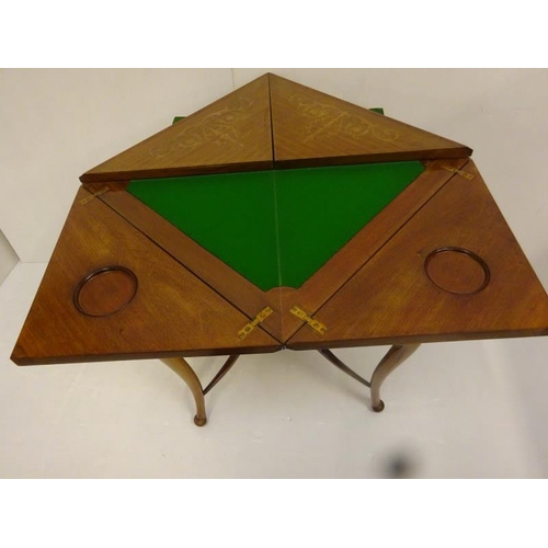 338 - Edwardian inlaid mahogany envelope card table fitted with a drawer and raised on curved legs.