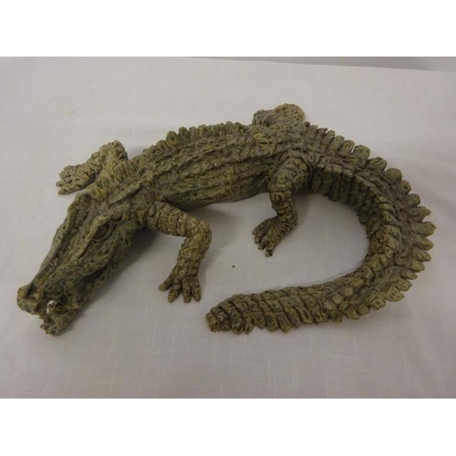 51 - Pottery sculpture of a crocodile, signed underneath.