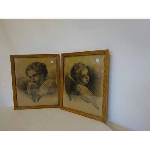 53 - A pair of oak framed prints, Angels.