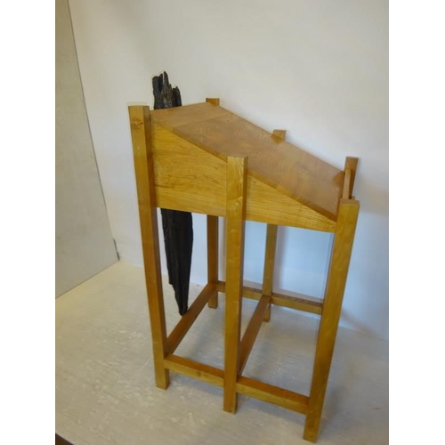 63 - A timber framed lectern and chair with bog oak decoration. H. 132cm D. 78cm.  W. 70cm approx.