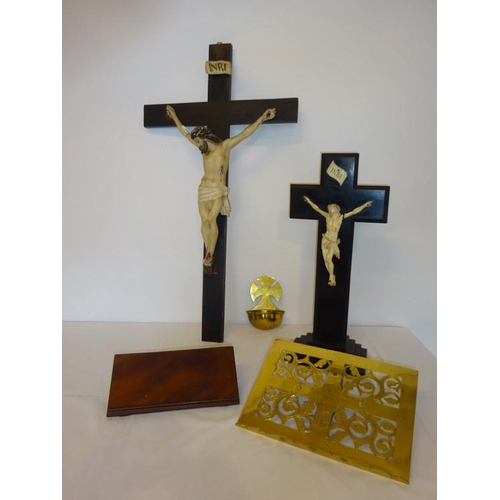 65 - Mixed lot - two crucifixes, a brass and timber reading stands and a brass holy water container by Eg... 