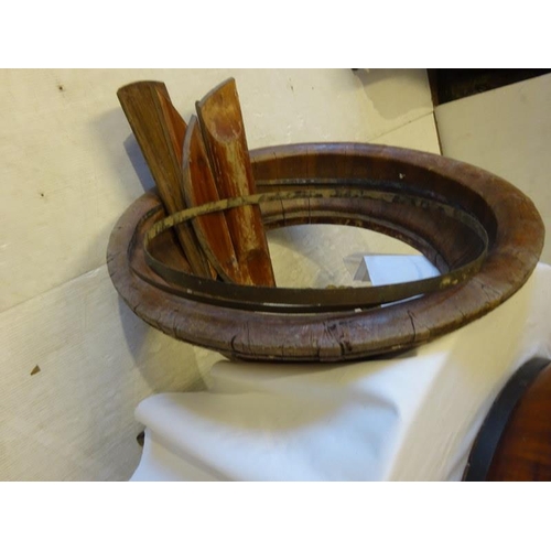 70 - Four large old brass banded timber bowls, one needing attention. Diameter 80cm approx.