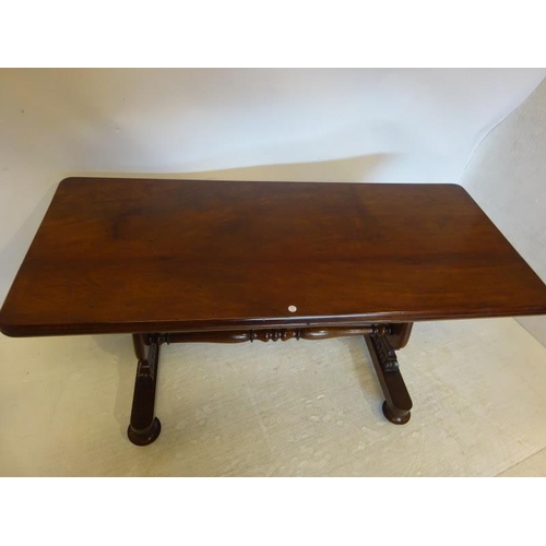 92 - A 19th century mahogany library table raised on side column supports with cross stretcher. W. 137cm,... 