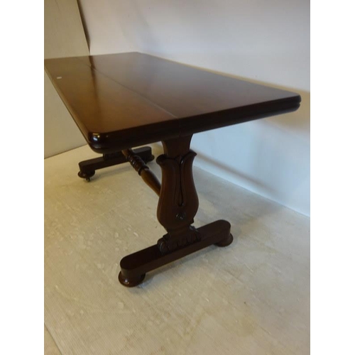 92 - A 19th century mahogany library table raised on side column supports with cross stretcher. W. 137cm,... 