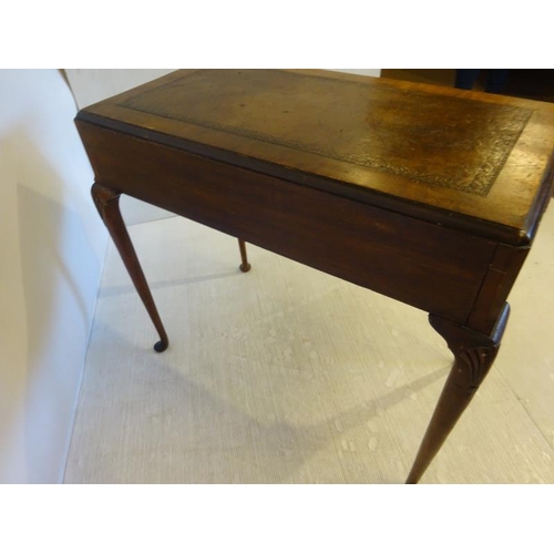 95 - An Edwardian walnut ladies writing table, the rectangular top with leather inset, fitted with two dr... 