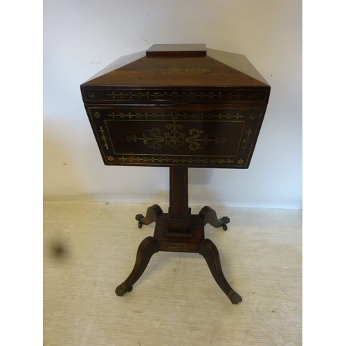 137 - A Regency rosewood and brass inlaid teapoy having a fitted interior and raised on splay legs with br... 