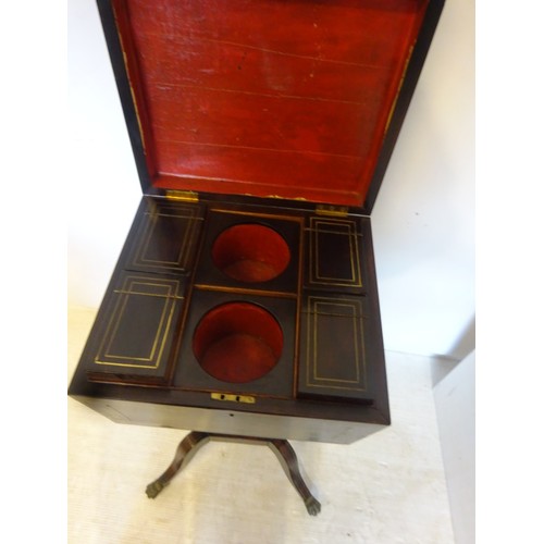 137 - A Regency rosewood and brass inlaid teapoy having a fitted interior and raised on splay legs with br... 