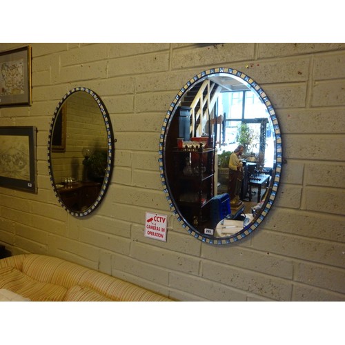 265 - A fine pair of antique Waterford mirrors of oval shape having alternating blue lozenge and gilt flut... 