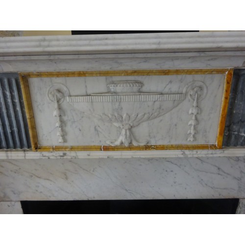 230 - A good Irish Georgian marble fireplace having Adams urn centre plaque, fluted columns with smaller u... 