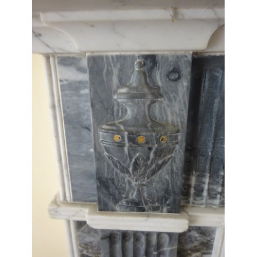 230 - A good Irish Georgian marble fireplace having Adams urn centre plaque, fluted columns with smaller u... 