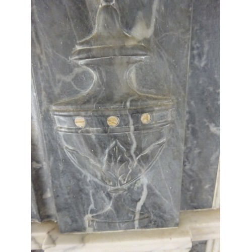 230 - A good Irish Georgian marble fireplace having Adams urn centre plaque, fluted columns with smaller u... 