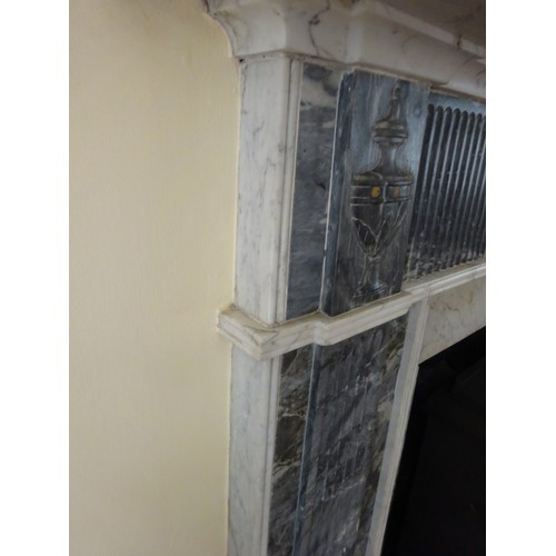 230 - A good Irish Georgian marble fireplace having Adams urn centre plaque, fluted columns with smaller u... 