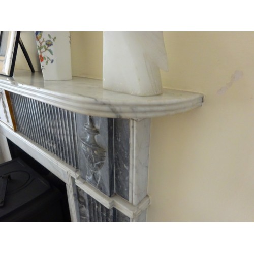 230 - A good Irish Georgian marble fireplace having Adams urn centre plaque, fluted columns with smaller u... 