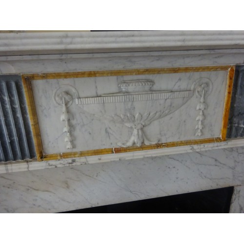 230 - A good Irish Georgian marble fireplace having Adams urn centre plaque, fluted columns with smaller u... 