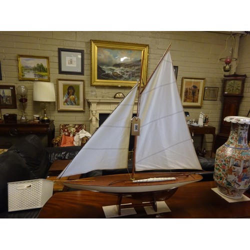 354 - Model of a yacht on stand.