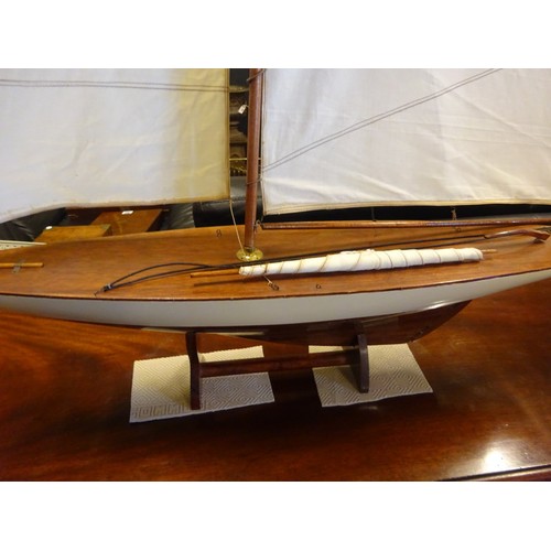 354 - Model of a yacht on stand.