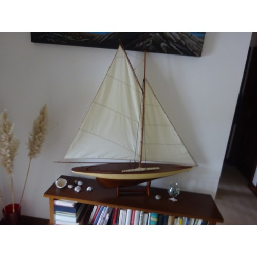 354 - Model of a yacht on stand.