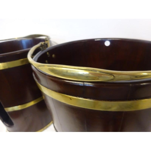 1 - A pair of Irish Georgian mahogany and brass banded peat and plate buckets. H. 43cm, D. 36cm approx. ... 