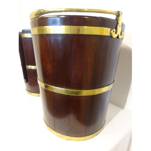 1 - A pair of Irish Georgian mahogany and brass banded peat and plate buckets. H. 43cm, D. 36cm approx. ... 