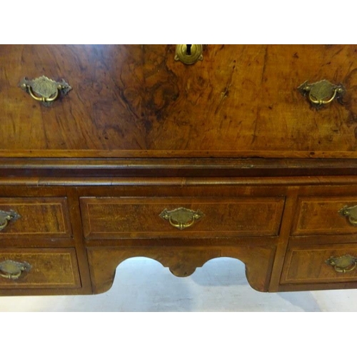 102 - A good 18th century walnut chest on legs, the upper section fitted with three short and three long d... 