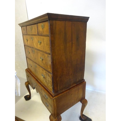 102 - A good 18th century walnut chest on legs, the upper section fitted with three short and three long d... 