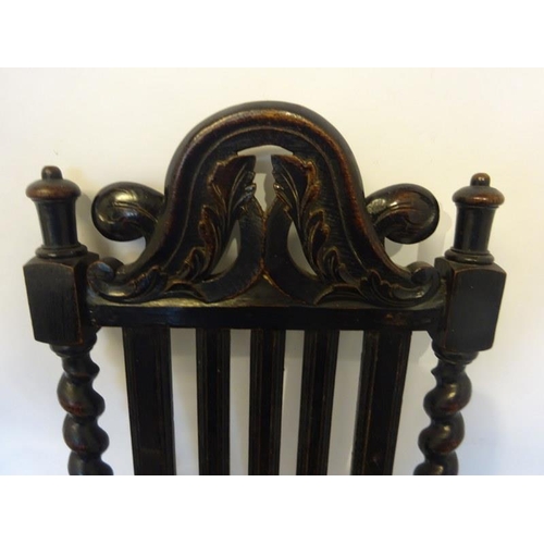 103 - Pair of antique carved oak hall chairs having shaped high backs with barley twist columns. Overall h... 