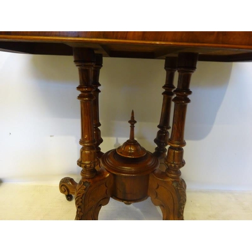 106 - Victorian inlaid and figured walnut card table, the folding top raised on four columns with carved s... 