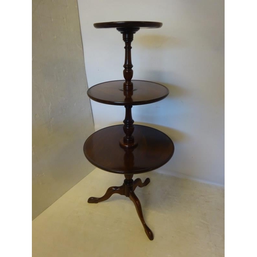 107 - Antique mahogany circular three tier dumbwaiter. H. 130cm approx.