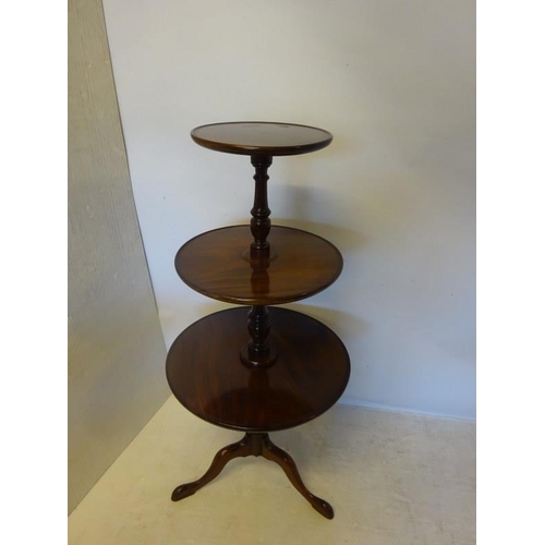 107 - Antique mahogany circular three tier dumbwaiter. H. 130cm approx.