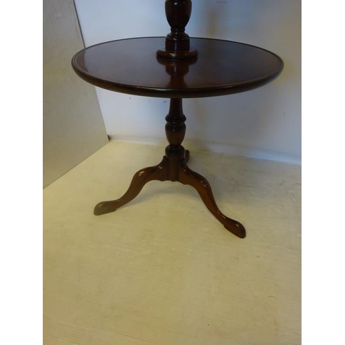 107 - Antique mahogany circular three tier dumbwaiter. H. 130cm approx.