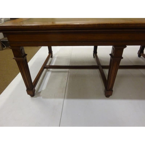 110 - A good antique oak library table, the rectangular top raised on 8 tapering legs with cross stretcher... 