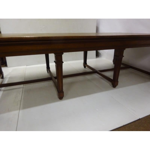 110 - A good antique oak library table, the rectangular top raised on 8 tapering legs with cross stretcher... 