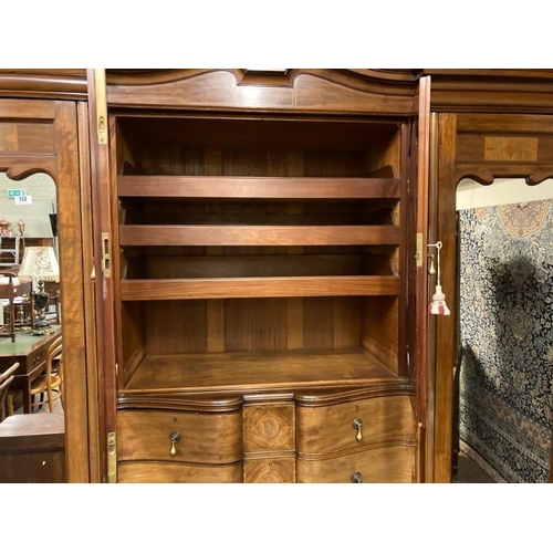 113 - An excellent quality Edwardian inlaid mahogany wardrobe having mirror and cupboard doors, shaped dra... 