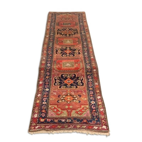 114 - A good Persian runner rug. 340cm x 104cm.