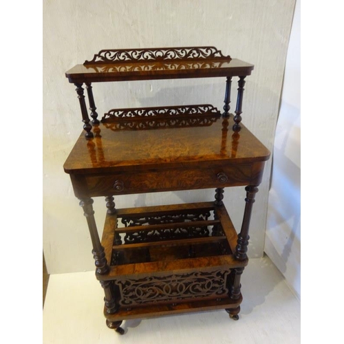 117 - A very good Victorian burr walnut canterbury fitted with a drawer and raised on turned legs.