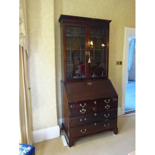 120 - Georgian mahogany bureau bookcase, the upper section with dentil cornice and section glass doors, th... 