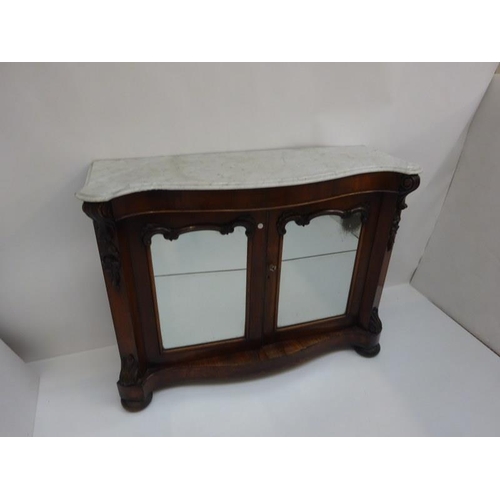 134 - Victorian rosewood side cabinet having serpentine shaped marble top over mirror doors on shaped base... 