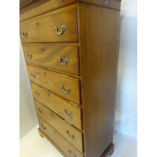 140 - A Georgian mahogany tall boy chest of 6 graduated drawers having brass drop handles and raised on br... 