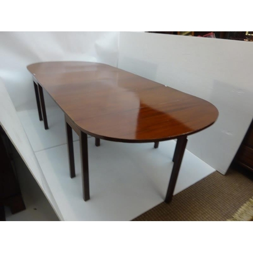 141 - A mahogany D-ended dining table raised on square legs.  260cm x 117cm approx.