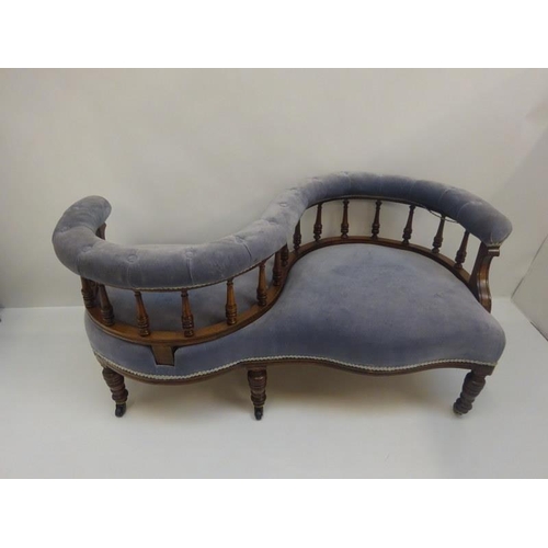 146 - Late Victorian conversation or love couch raised on turned legs.