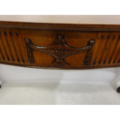 150 - A fine antique mahogany side table, the shaped top and sides having fluted and urn decoration raised... 