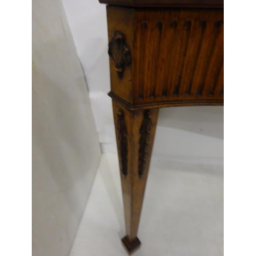 150 - A fine antique mahogany side table, the shaped top and sides having fluted and urn decoration raised... 